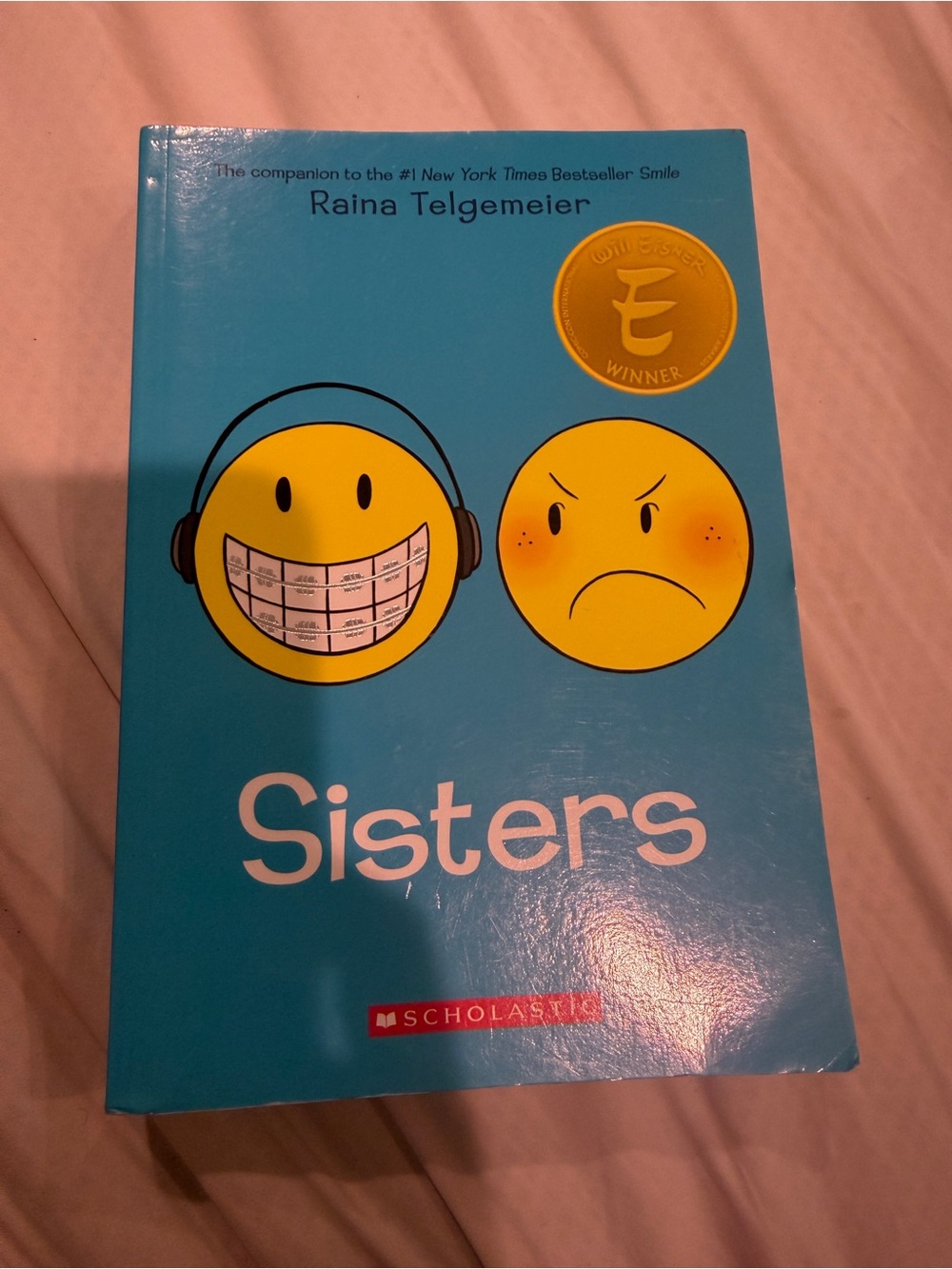 Sisters by Raina Telgemeier — Bright Teal Paperback